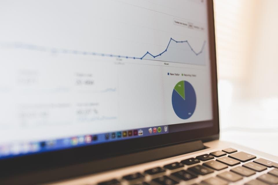 An analytics traffic chart on a laptop screen.